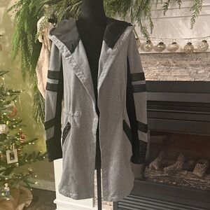 Blanc Noir Maitri Traveler Jacket in Gray with black leather accents.